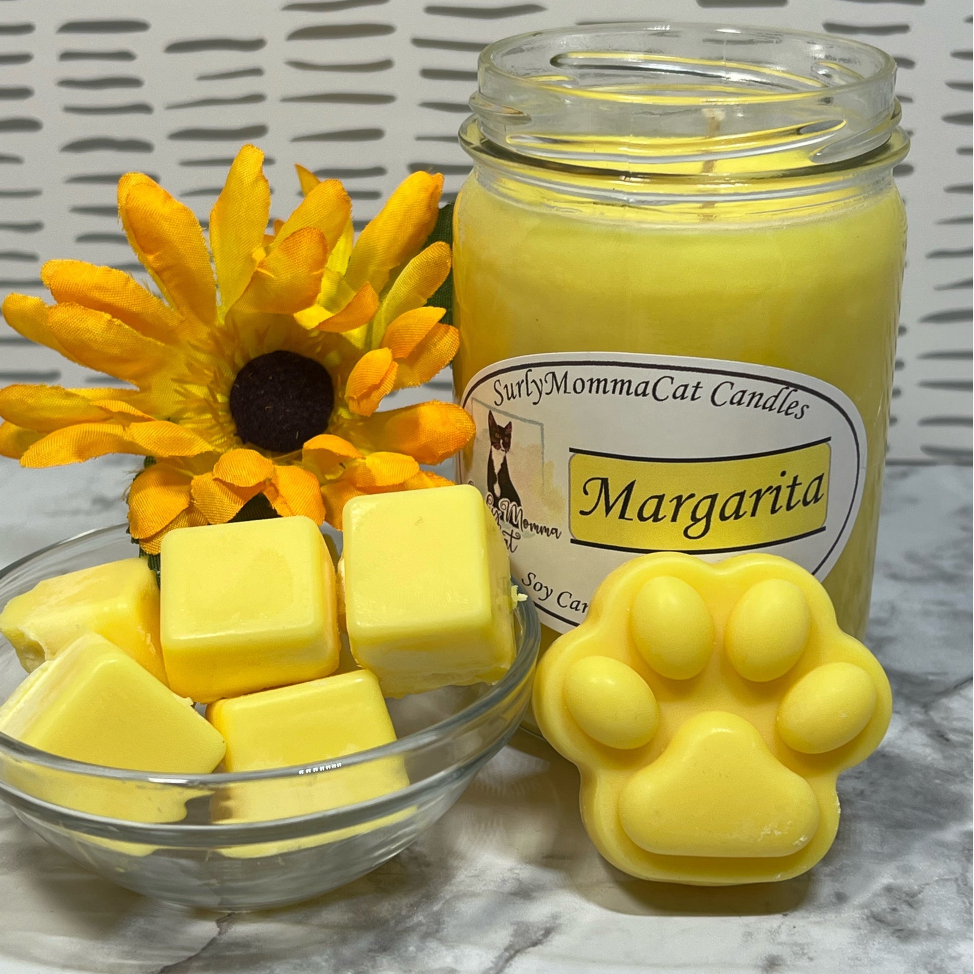 Yellow soy Margarita candle with pawprint and cube wax melts with sunflower accent.