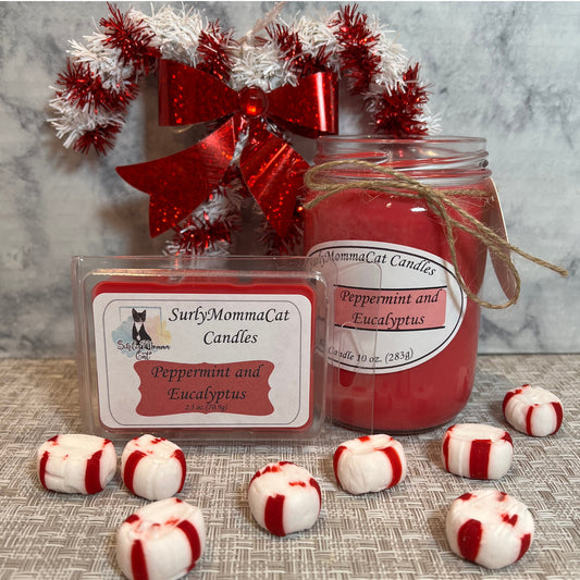 A warm scented Peppermint and Eucalyptus Christmas scene, with your choice of candle type, whether that be in a 10 oz jar, or cubed wax melts, with a red and white Christmas wreath as background decoration, topped off with peppermint candy droppings