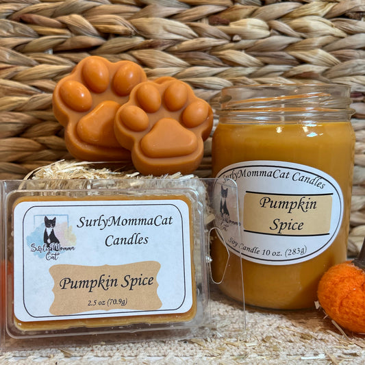 Orange Pumpkin Spice soy glass jar candle, wax melts, and wax melt paw prints with a small decorative hay bale and tiny pumpkin.